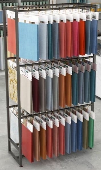 Sofa and curtain fabric swatch rack at the Geet Furnishings showroom