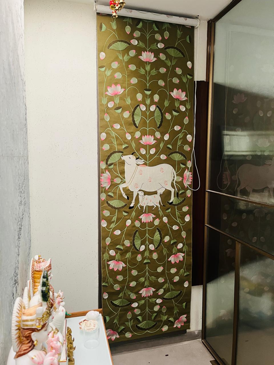 Custom Pichwai-print roller blind beside a home temple
