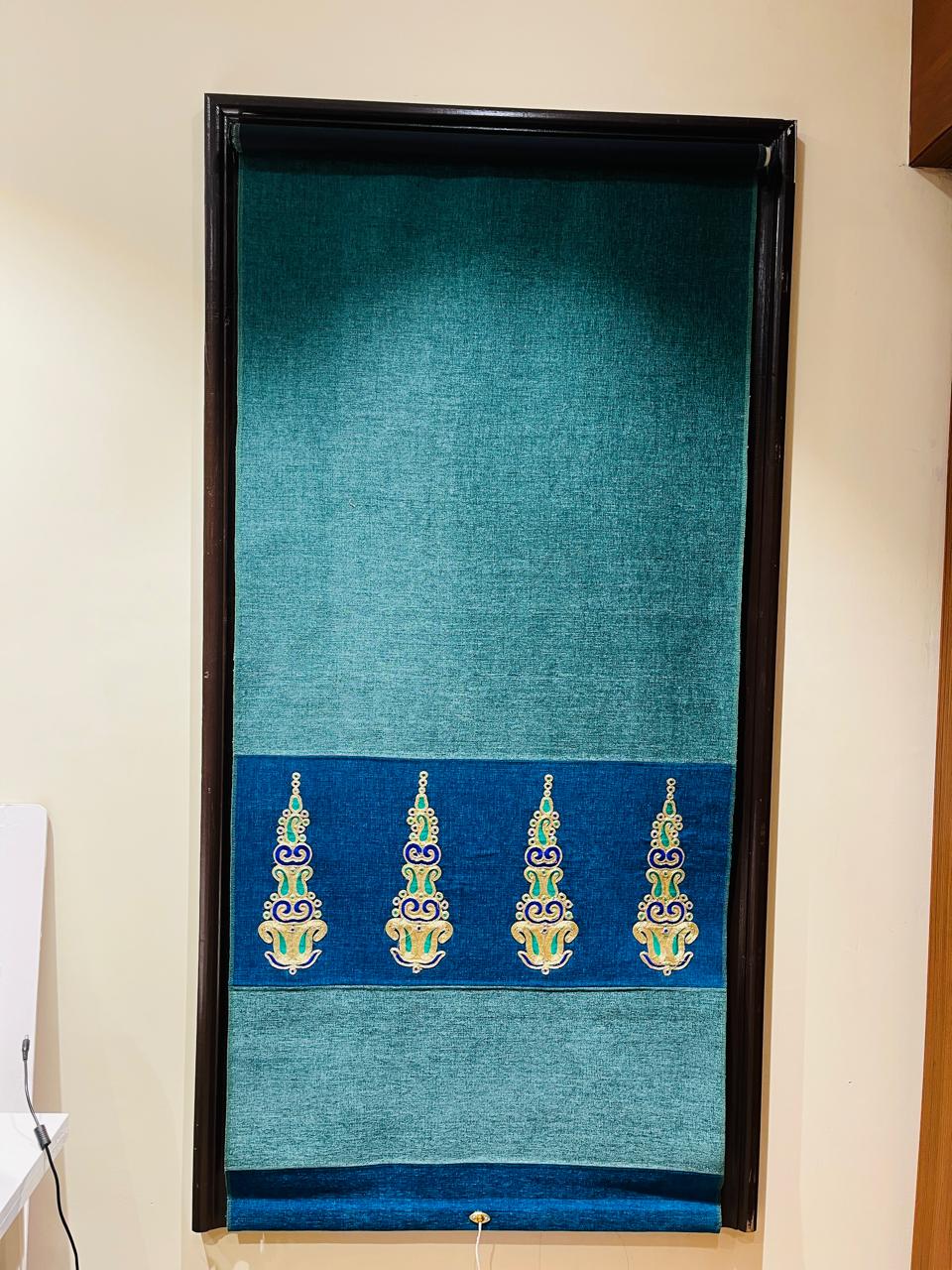Teal chenille roller blind with zari-embroidered border